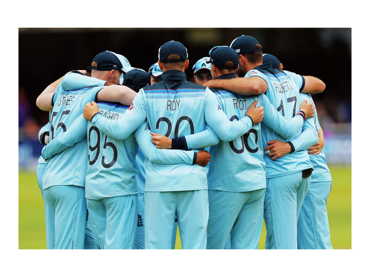 England huddle before they go out to field
