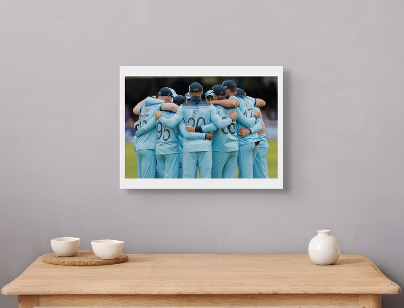 England huddle before they go out to field