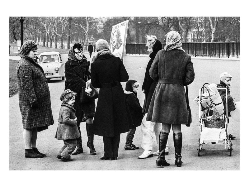 A demonstrator engages with passers-by, 1971